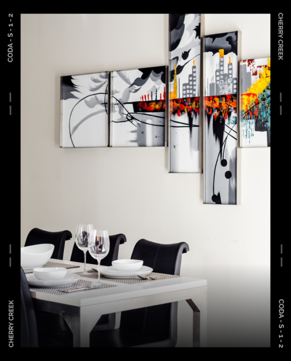 Dining room with modern dining furniture and wall artwork.
